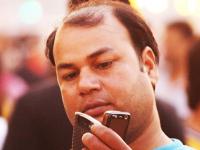 Man with two Mobiles!