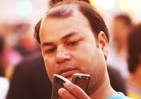 Man with two Mobiles!